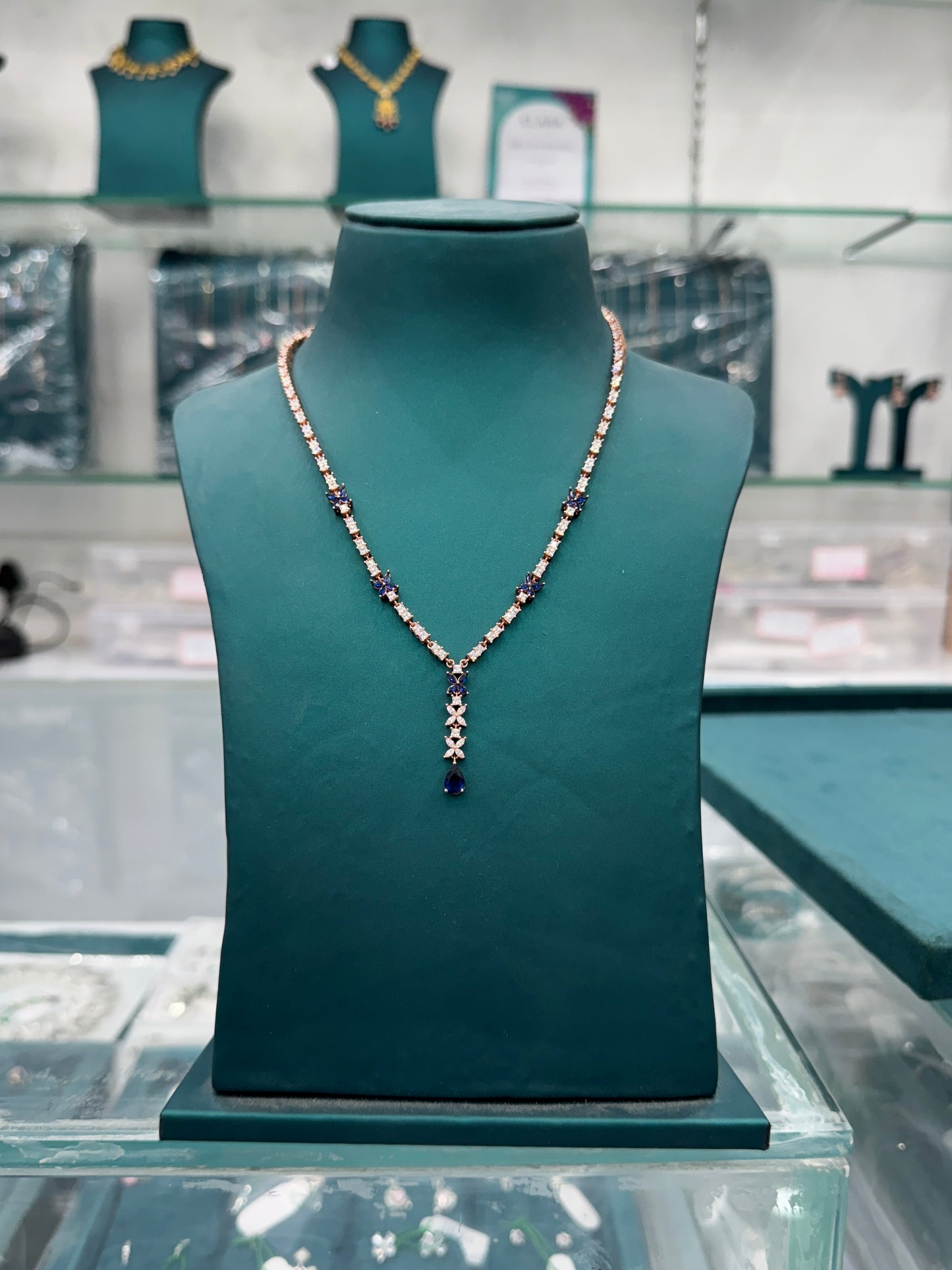 Butterfly motifs and teardrop-shaped blue sapphires look -alike